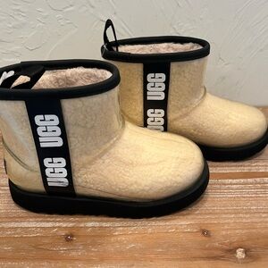 UGG Classic Clear Mini Tan Shearling Boots with Black Trim